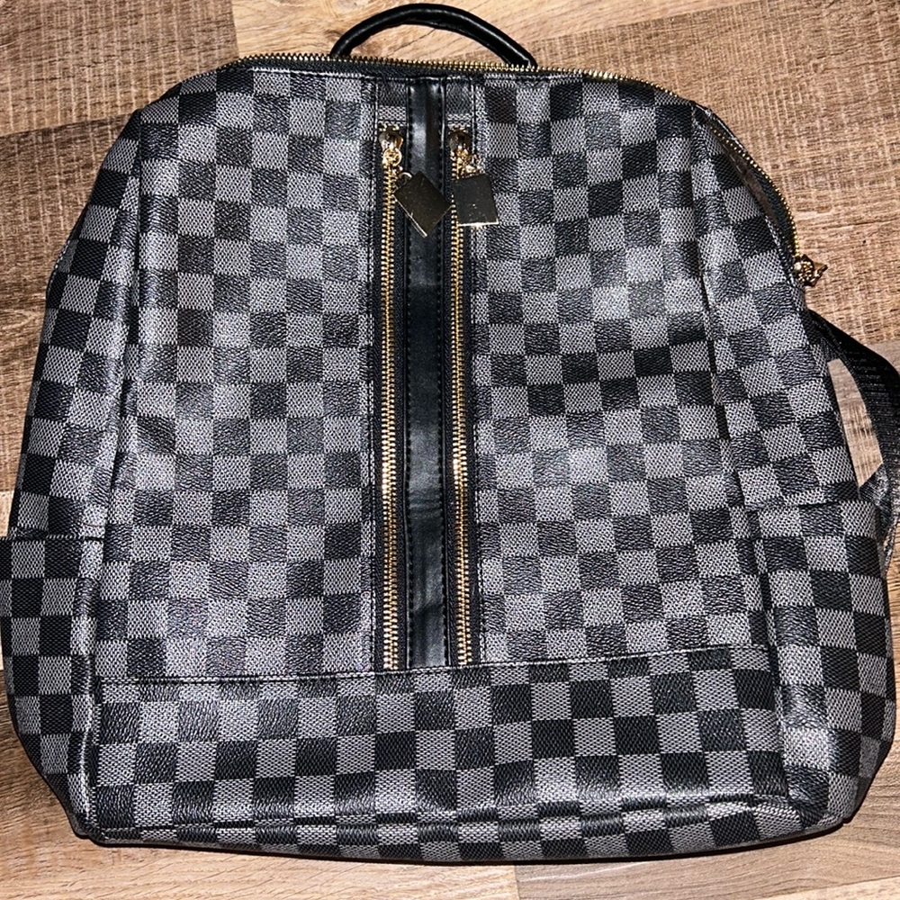 Black checkered backpack purse and wristlet